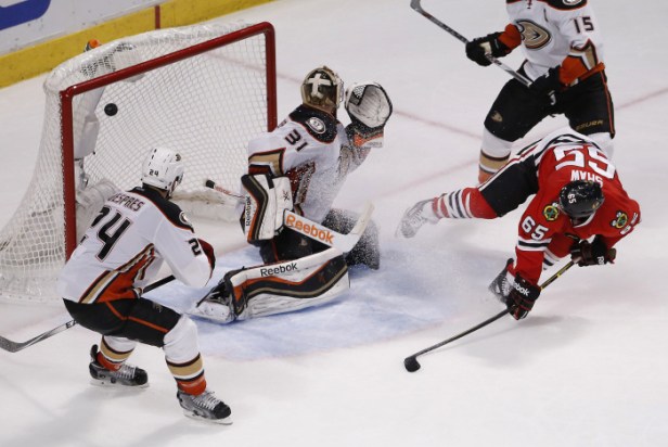 Chicago Blackhawks center Andrew Shaw (65) watches his shot score against Anaheim Ducks goalie Frederik Andersen (31) during the third period in Game 6 of the Western Conference finals of the NHL hockey Stanley Cup playoffs, Wednesday, May 27, 2015, in Chicago. The Blackhawks won 5-2. (AP Photo/Charles Rex Arbogast)