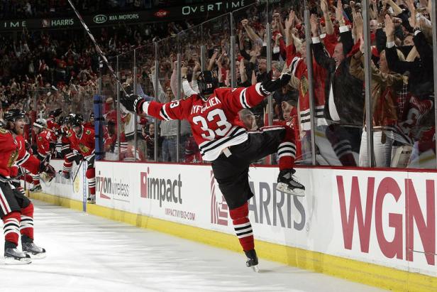 CHICAGO - MAY 21:  Dustin Byfuglien #33 of the Chicago Blackhawks celebrates after scoring the game-winning goal against the San Jose Sharks in Game Three of the Western Conference Finals during the 2010 NHL Stanley Cup Playoffs on May 21, 2010 at the United Center in Chicago, Illinois. (Photo by Bill Smith/NHLI via Getty Images)